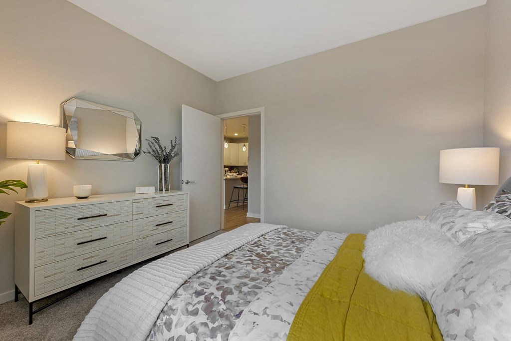 a bedroom with a bed and a dresser  at Delamarre at Celebration, Celebration, FL 34747