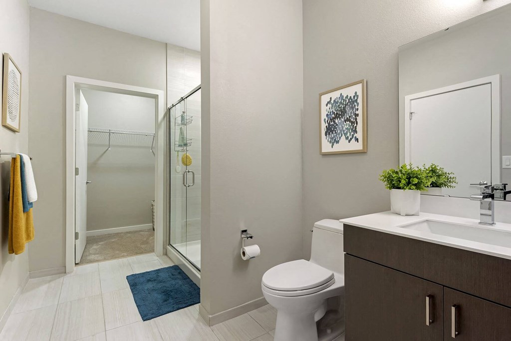 a bathroom with a toilet sink and shower at Delamarre at Celebration, Celebration, FL 34747