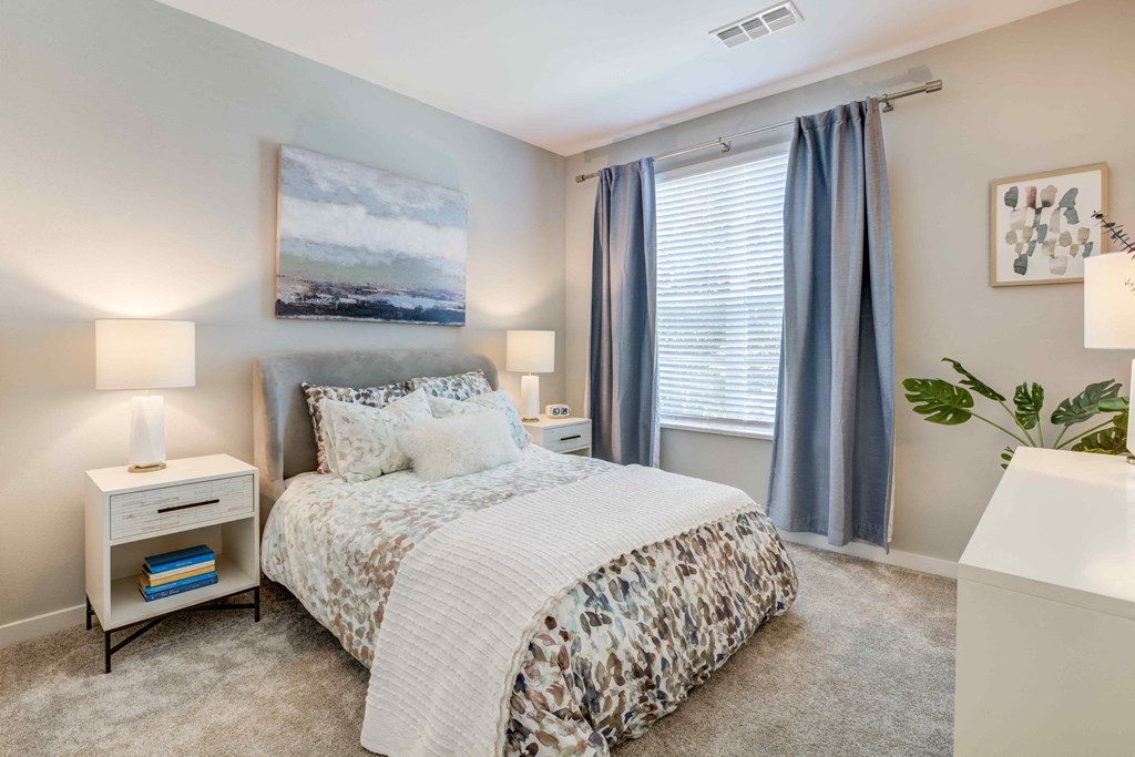 a bedroom with a bed and two night stands at Delamarre at Celebration, Florida, 34747