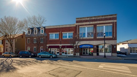 a brick building with cars parked in front of it at North Market South Carroll, Maryland