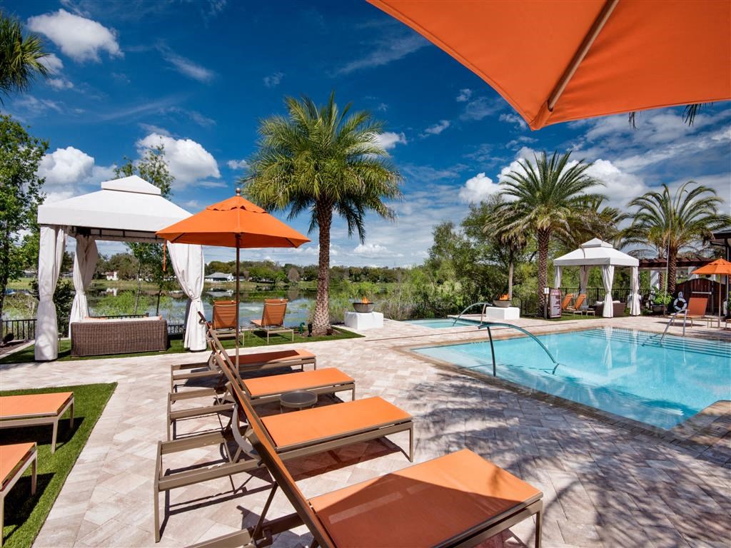 Swimming Pool Area With Shaded Chairs at Town Trelago, Maitland, FL