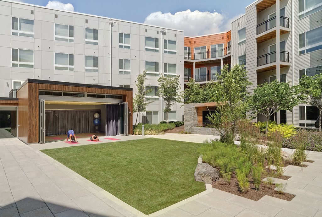 people playing in the courtyard of an apartment building at Fort Totten Square, Washington, 20011