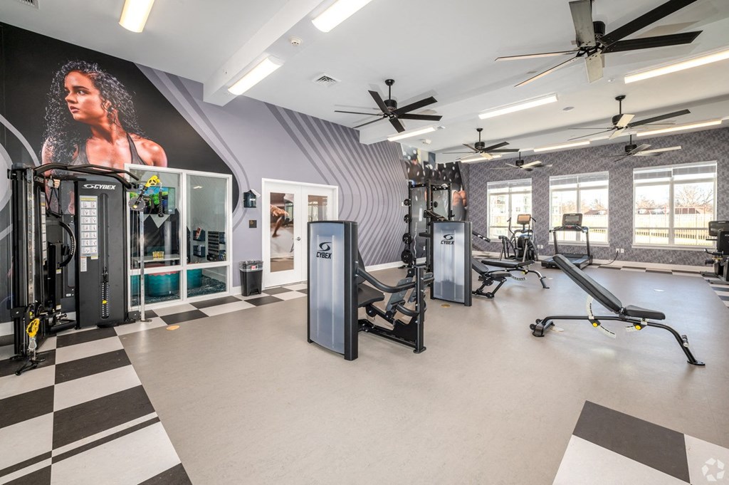 a view of the elevators in the lobby of a building with rows of columns at Fairmont at South Lake, Bowie, 20716