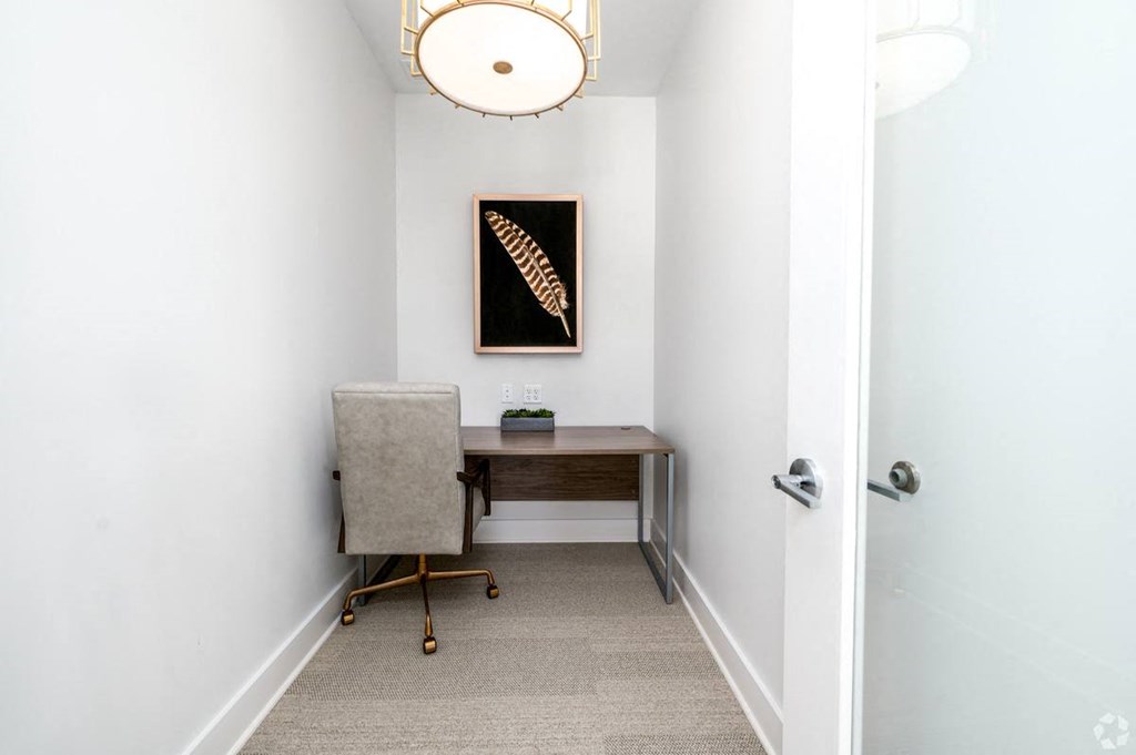 a home office with a desk and chair in a room with a door at Fairmont at South Lake, Bowie, MD, 20716