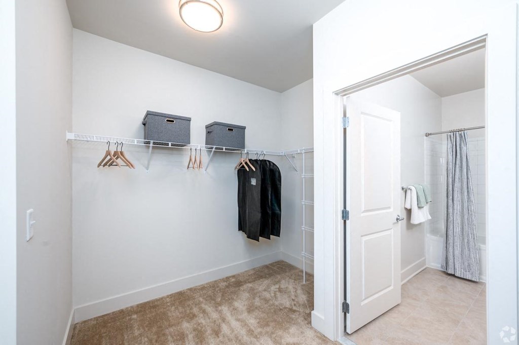 a closet in a bedroom with a door to a shower at Fairmont at South Lake, Bowie, MD
