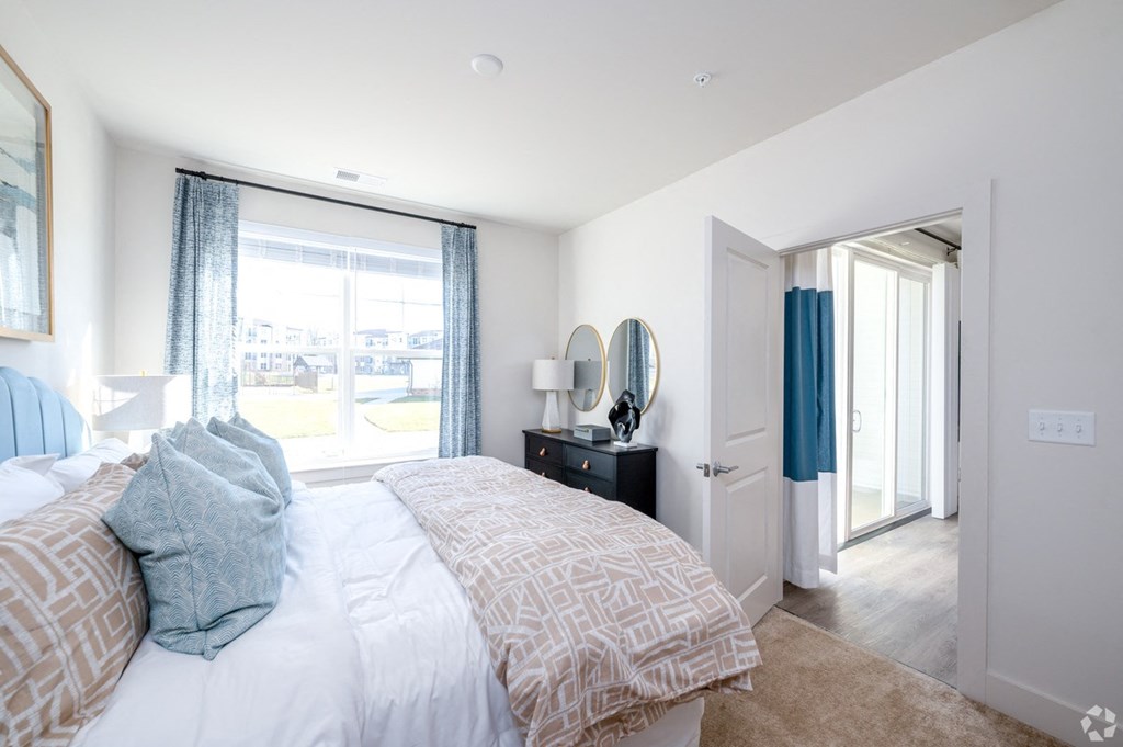 a bedroom with a large bed and a window at Fairmont at South Lake, Maryland, 20716