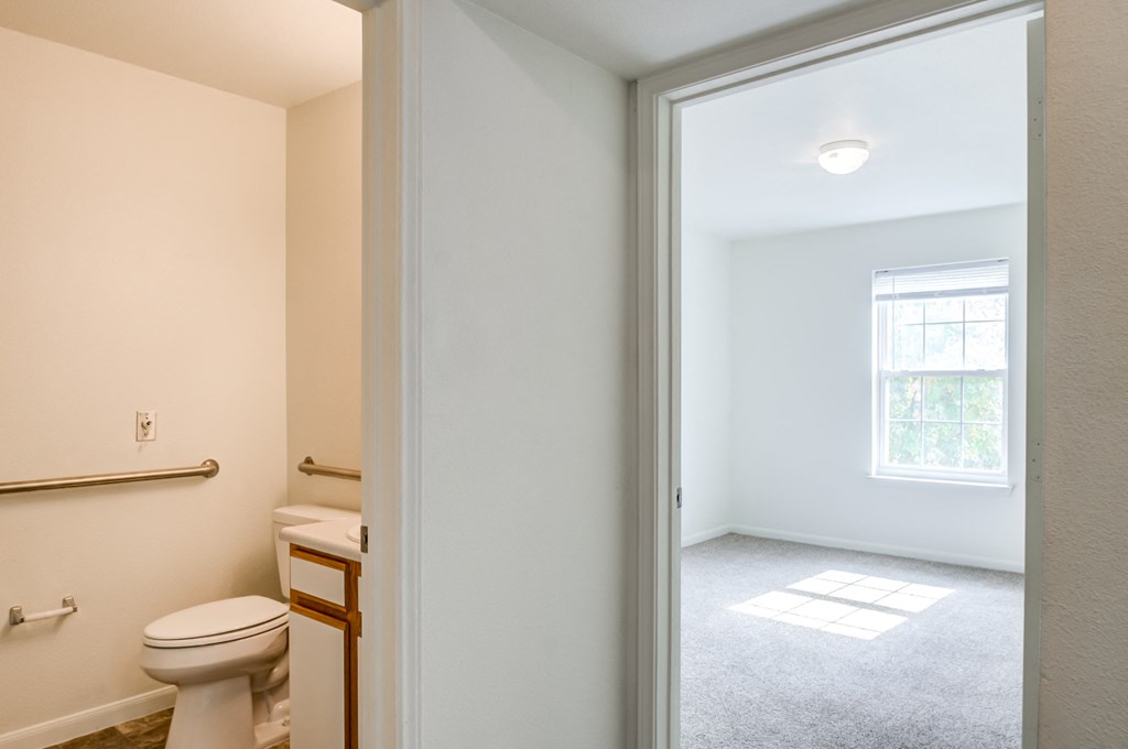 a bathroom with a toilet and a sink