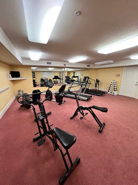 a gym with a bunch of exercise equipment in it
