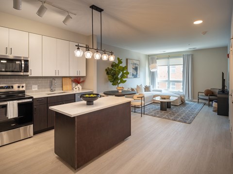 A modern kitchen with a large island in the middle.