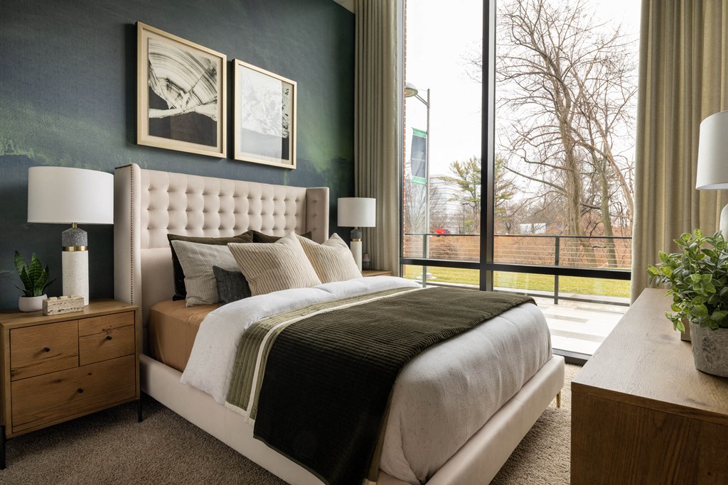 a bedroom with a bed and a window  at Brentford at The Mile, Tysons, VA