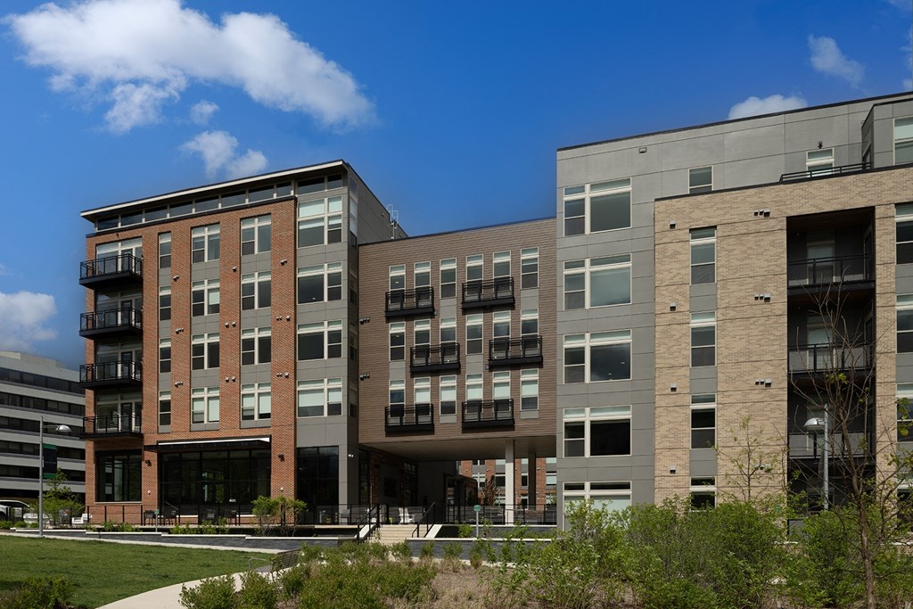 a photo of the exterior of a building at Brentford at The Mile, Tysons, Virginia