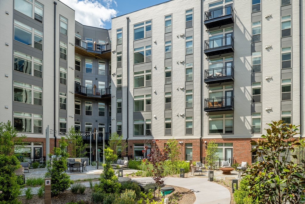 picture of an apartment complex with a courtyard at Brentford at The Mile, Virginia, 22102