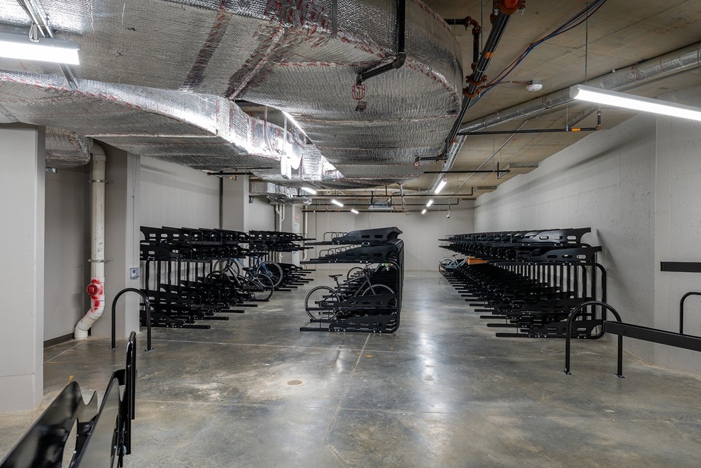 a row of bikes in a parking garage at Brentford at The Mile, Virginia, 22102