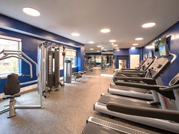 a gym with cardio equipment and weights on the floor at Lincoln Old Town, Alexandria, 22314