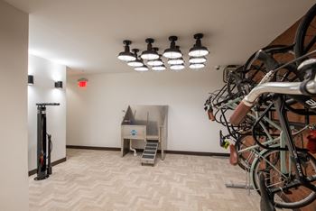 a room with bikes on the wall and a piano