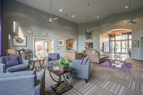 A living room with grey couches and a coffee table.