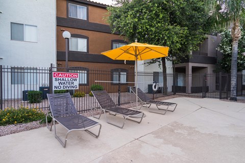 A pool area with a sign at Sterling Point Apartment Homes, Phoenix, Arizona