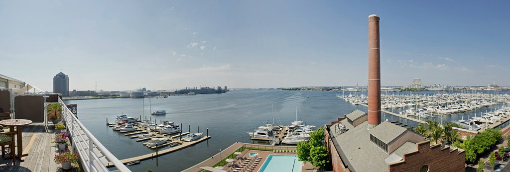 a view of the harbor from a building with a pool and boats in the water at Tindeco Wharf, Maryland