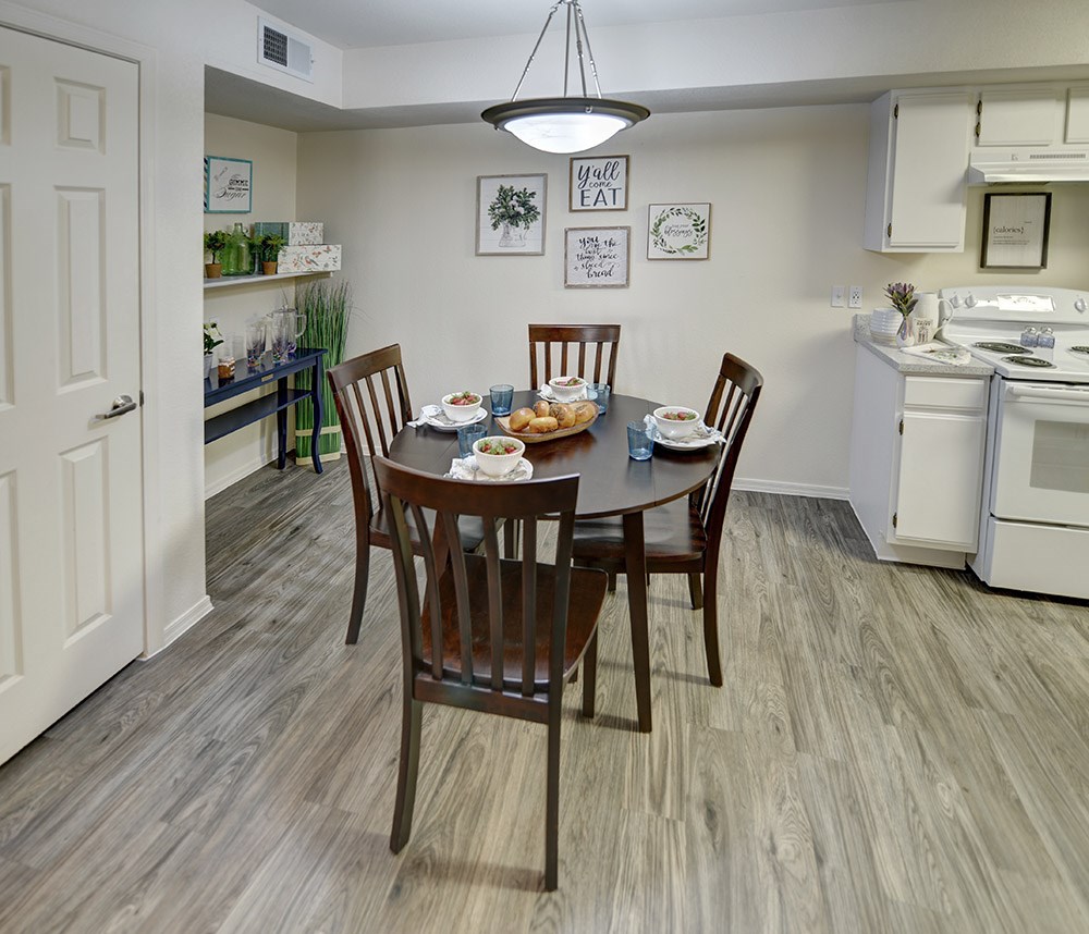 A dining room with a table set for four.at Cottonwood Crossing, Casa Grande  