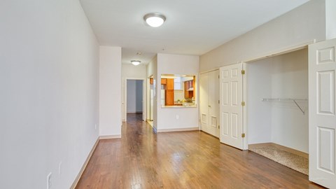 a renovated living room with a hard wood floor and white walls at North Market South Carroll, Maryland, 21701