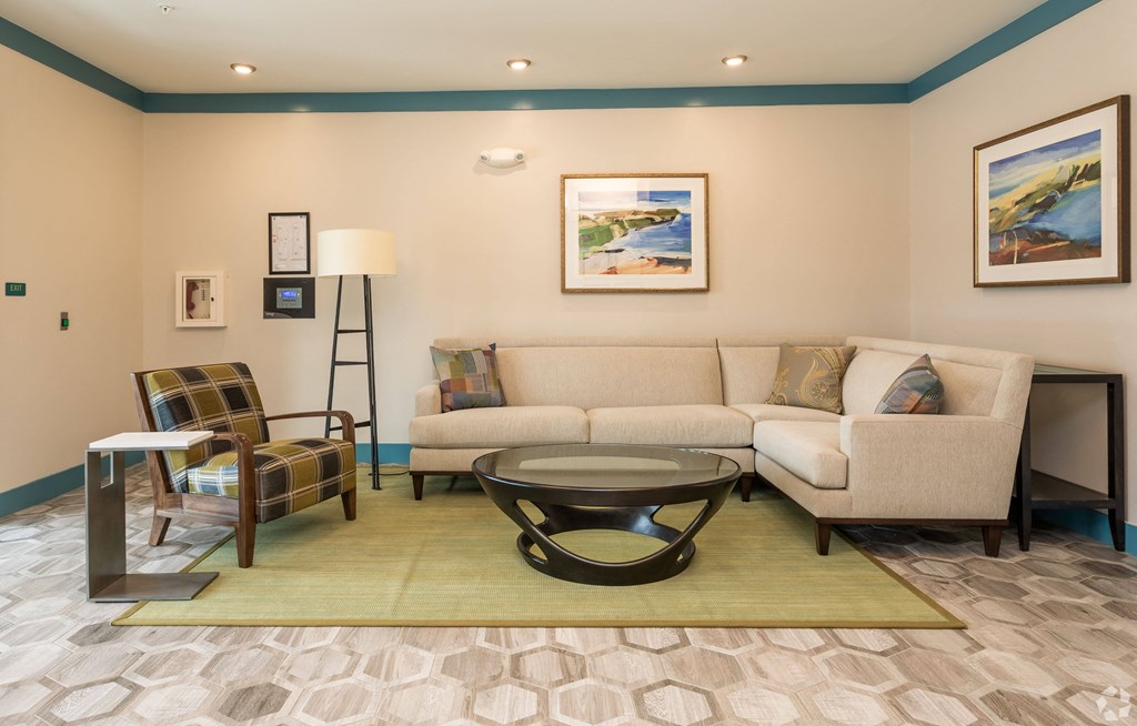 a living room with a couch and a table