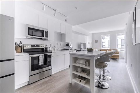 a kitchen with a counter top and a stove