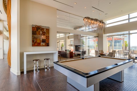 a game room with a pool table and a bar at The Acadia at Metropolitan Park, Virginia, 22202