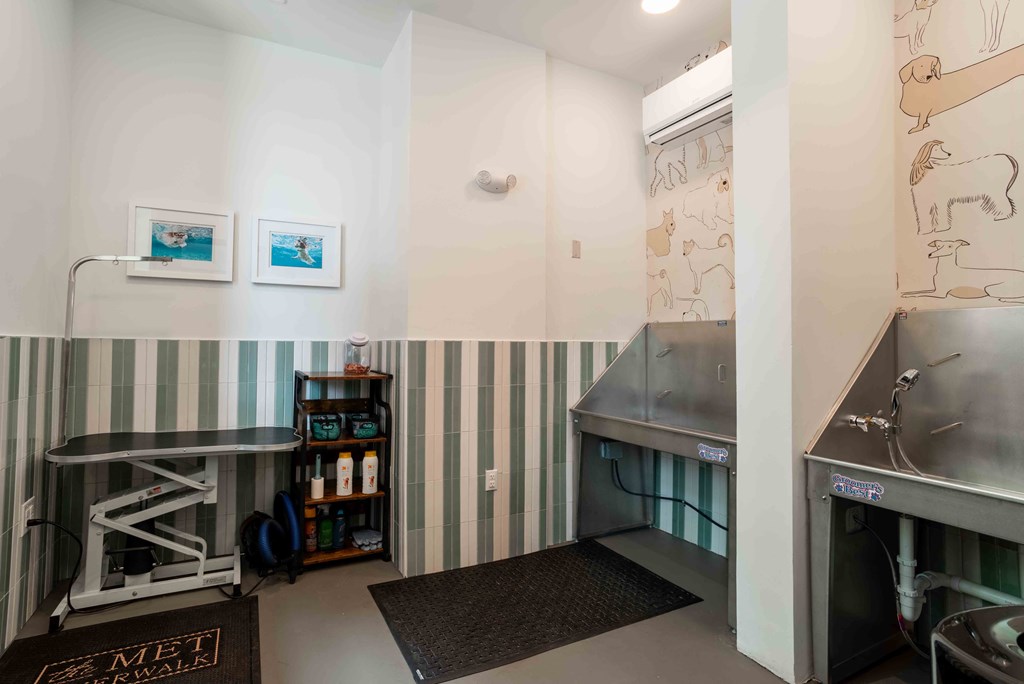a laundry room with two sinks and a urinal at the Riverwalk, Wilmington, North Carolina