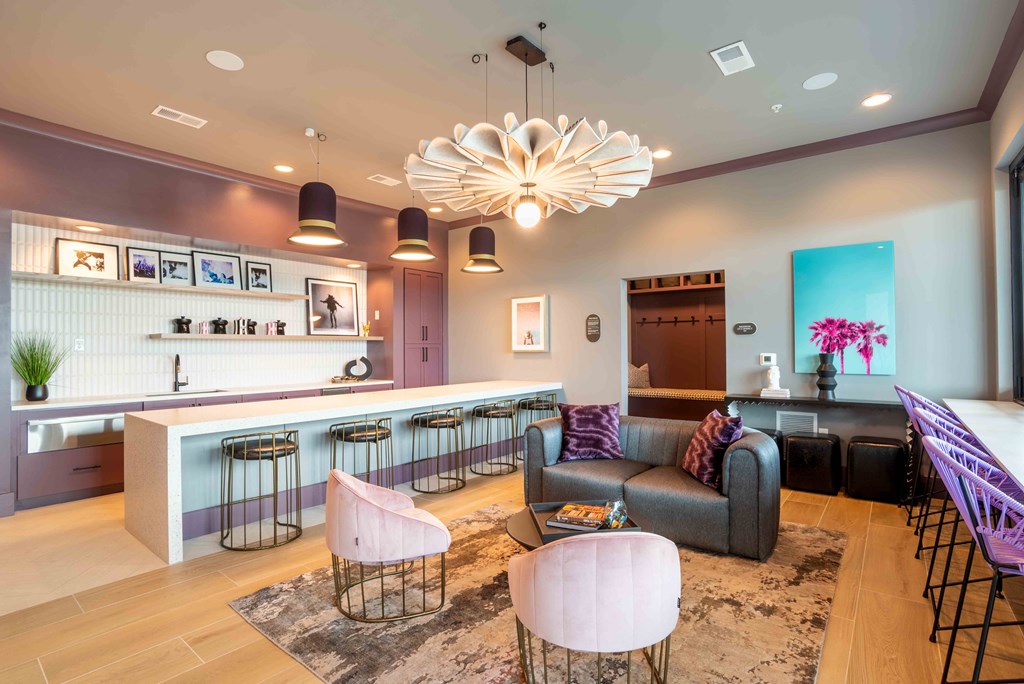 a living room with a bar and a couch at Metropolitan at the Riverwalk, Wilmington, NC