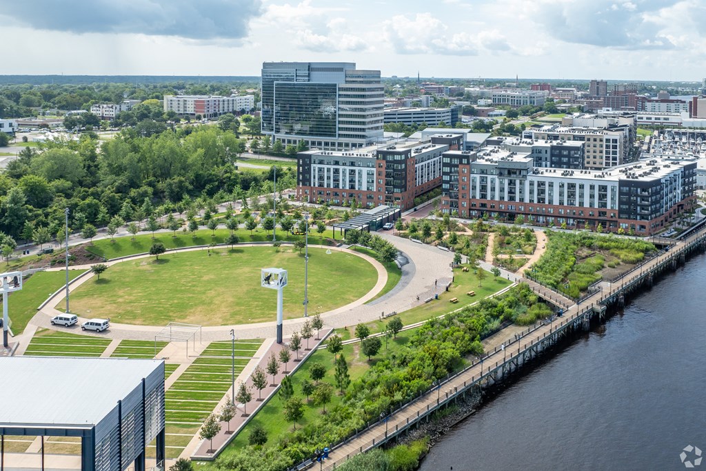 an aerial view of a park next to a riverat Metropolitan at the Riverwalk, North Carolina
