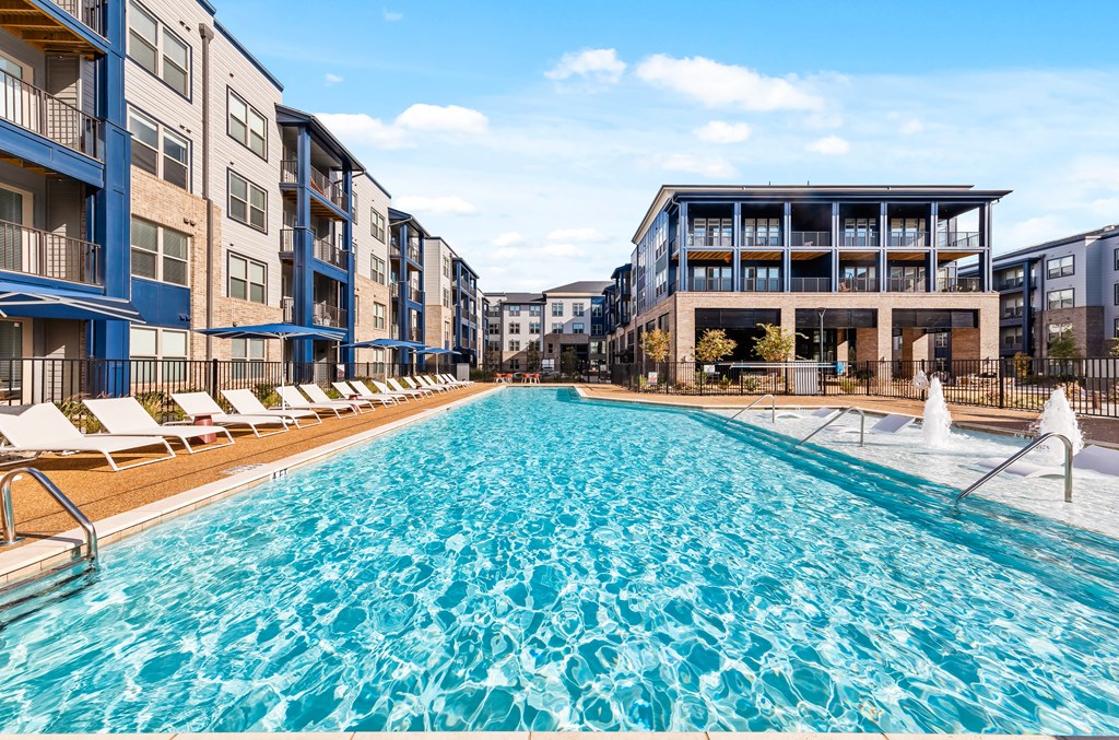 A large swimming pool in front of apartment buildings at Preston Ridge in Cary, North Carolina.