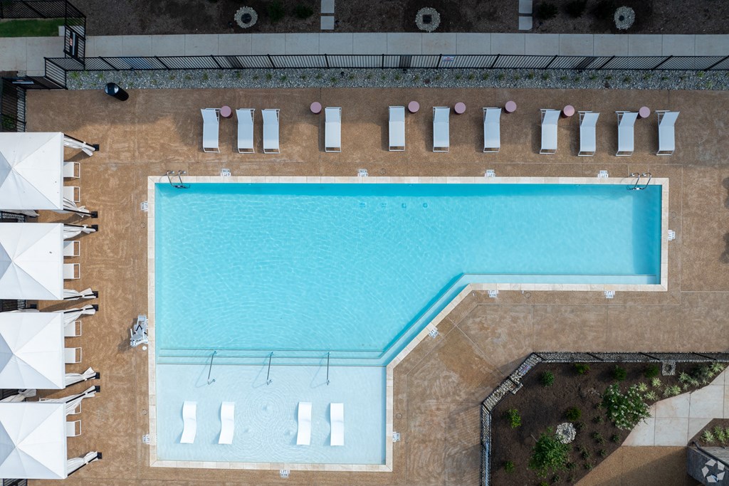 an overhead view of a swimming pool with umbrellas at Preston Ridge, Cary, NC, 27513