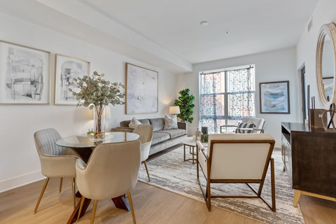 a living room with white walls and a dining room table and chairs at Rialto, Washington, 20002