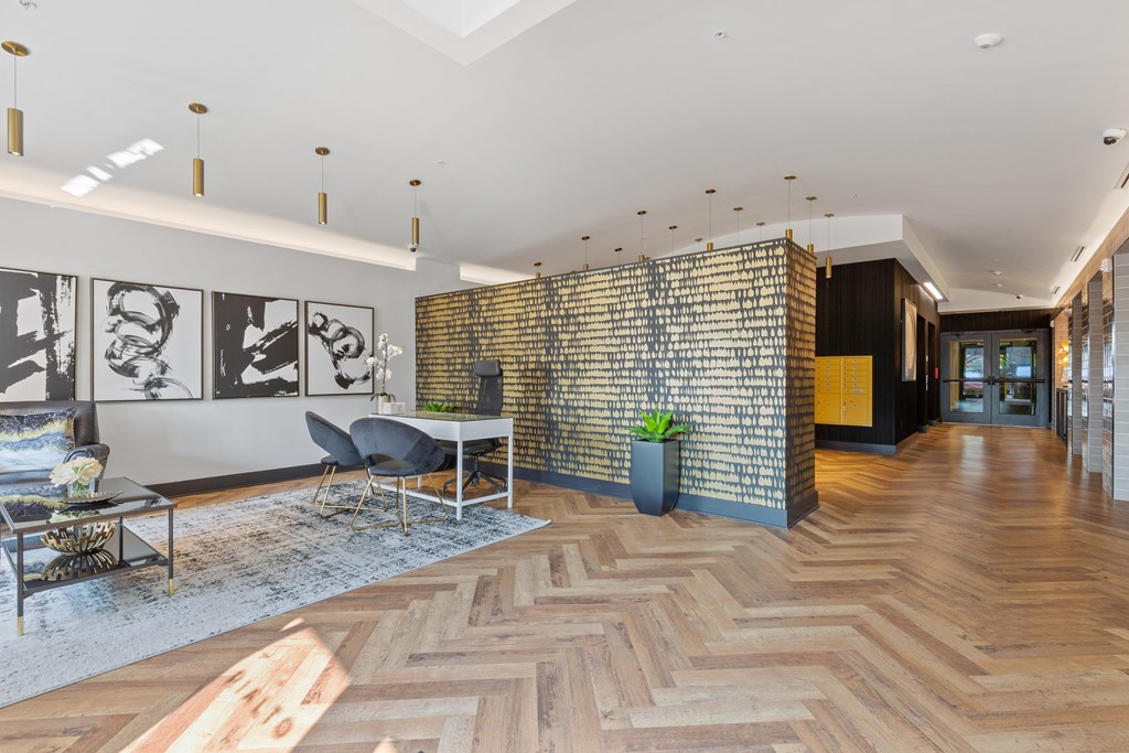 a living room with a table and chairs and a brick wall at Rialto, Washington, DC