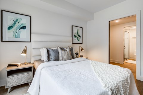 a bedroom with a large bed and a mirror at Rialto, Washington, DC 20002