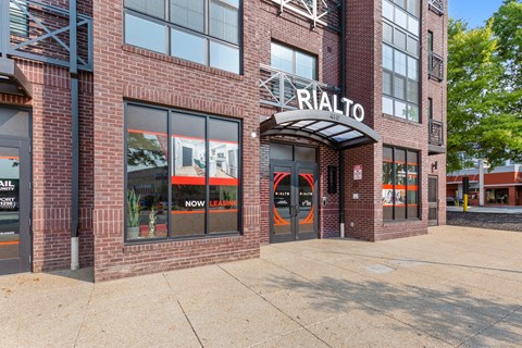 a brick building with a sign on the front of it at Rialto, Washington, DC 20002