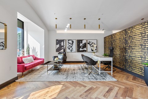 a living room with a white table and a red couch at Rialto, District of Columbia