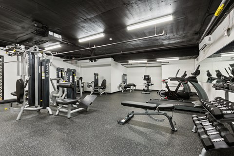 a gym with weights and other equipment in a building with black ceilings at Rialto, Washington, 20002