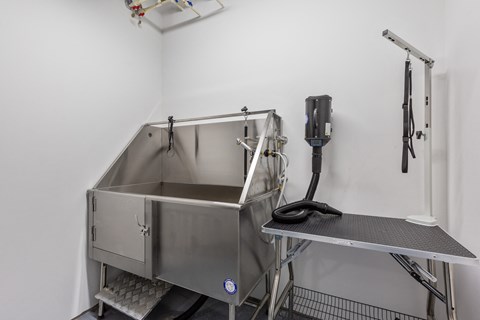a stainless steel sink in a room with a phone on the wall at Rialto, District of Columbia