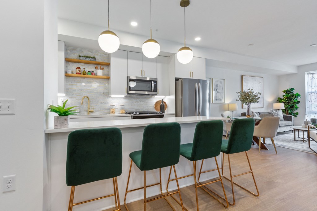 an open kitchen and living room with green bar stools at Rialto, Washington District of Columbia