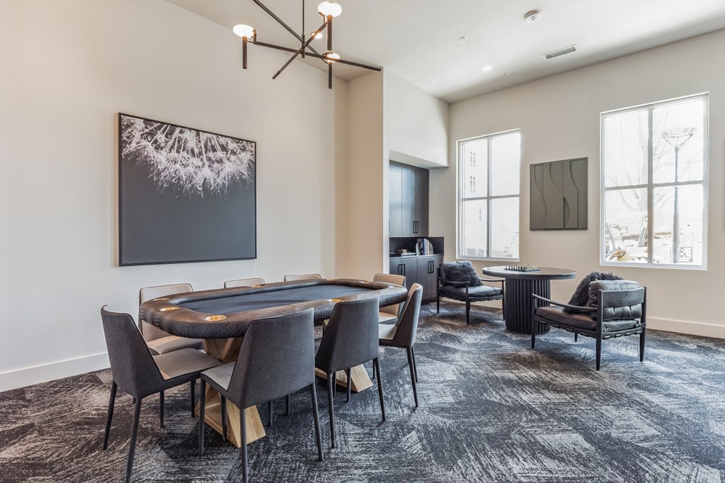a communal area with a table and chairs and a pool table at South and Hollis, Charlotte, NC