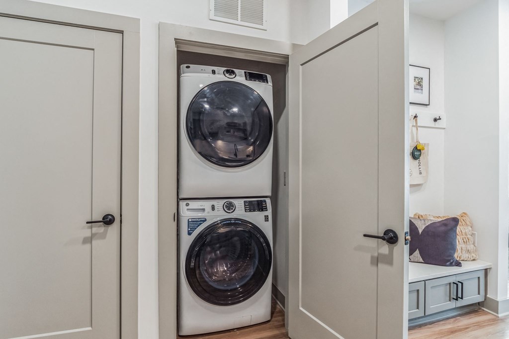 a small laundry room with a washer and a dryer at South and Hollis, Charlotte