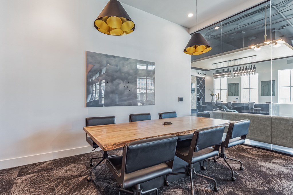 a conference room with a wooden table and chairs at South and Hollis, Charlotte, NC, 28209