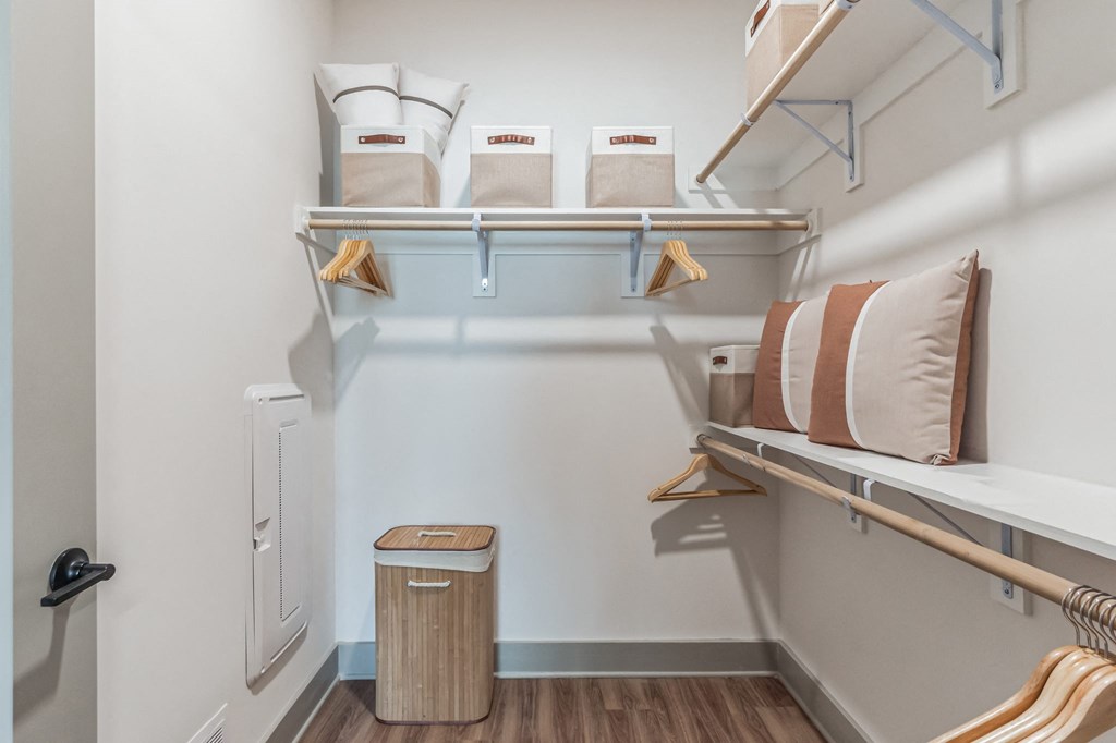 a bedroom with a bunk bed and a closet with shelves and a trash can at South and Hollis, Charlotte, NC, 28209