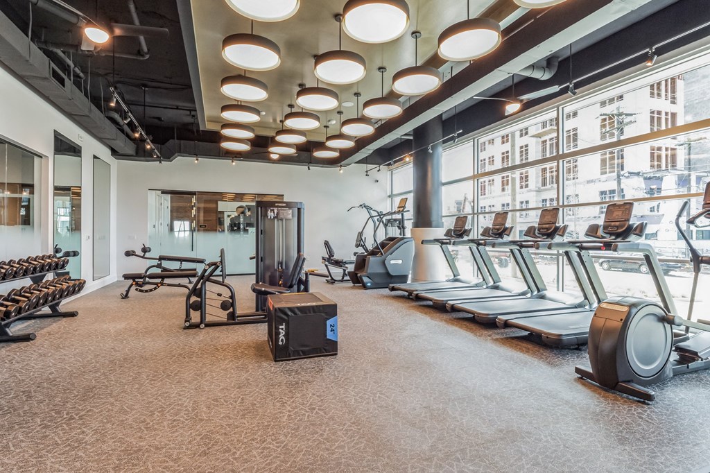a fitness room with treadmills and other exercise equipment at South and Hollis, Charlotte, NC, 28209