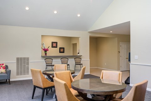 a dining room with a table and chairs