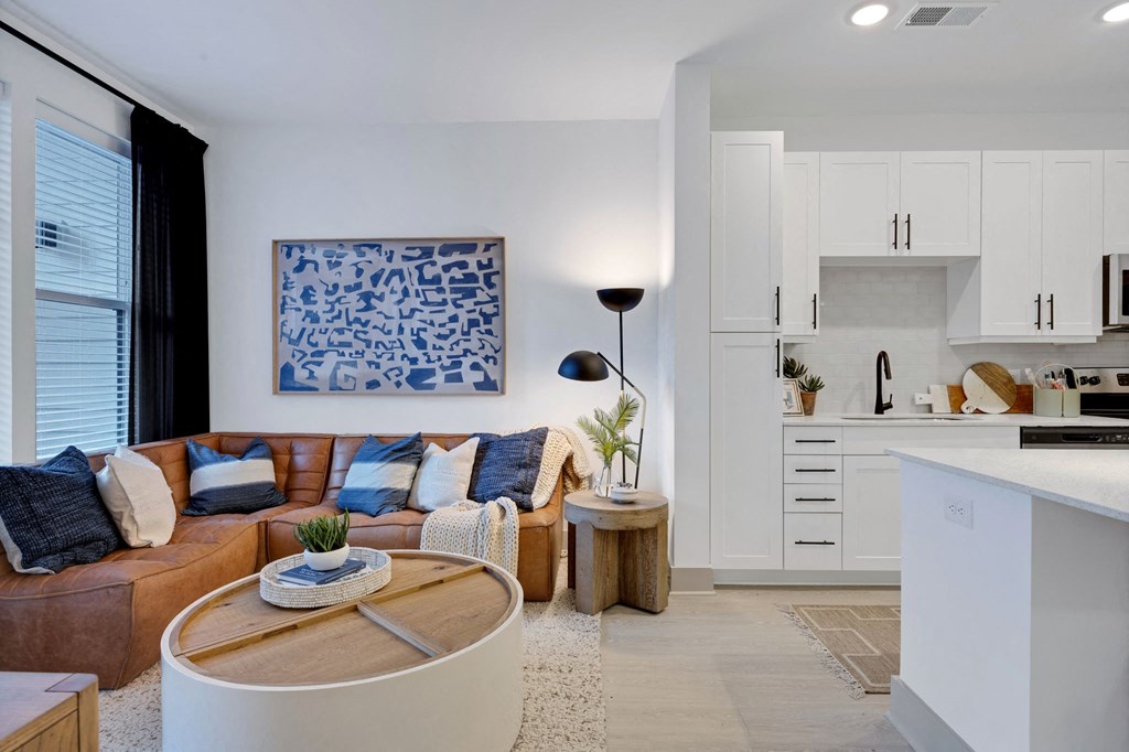 a living room with a couch and a table at Metropolitan at the Riverwalk, Wilmington, NC