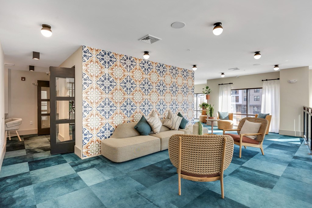a living room with a tile wall and a couch at the Riverwalk, Wilmington, 28401