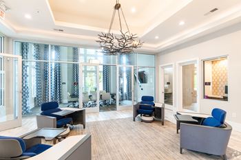 A Modern Office Space With Chandelier at The Aster Apartments, Cary, NC, 27519