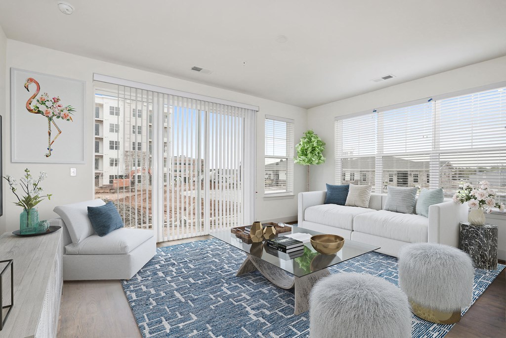 a living room with a white couch and a coffee table